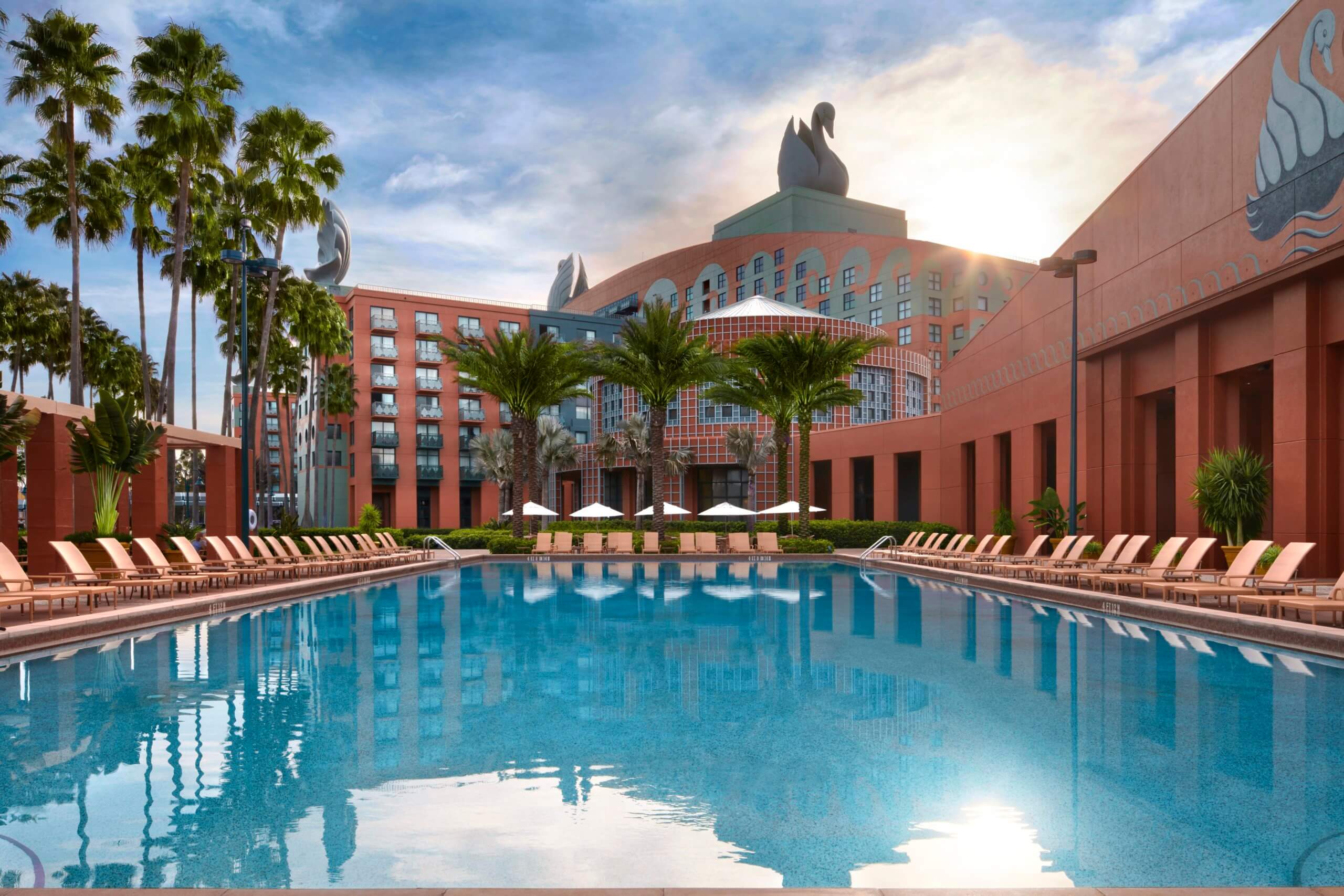 Pool with Chairs, Umbrellas and Palm Trees